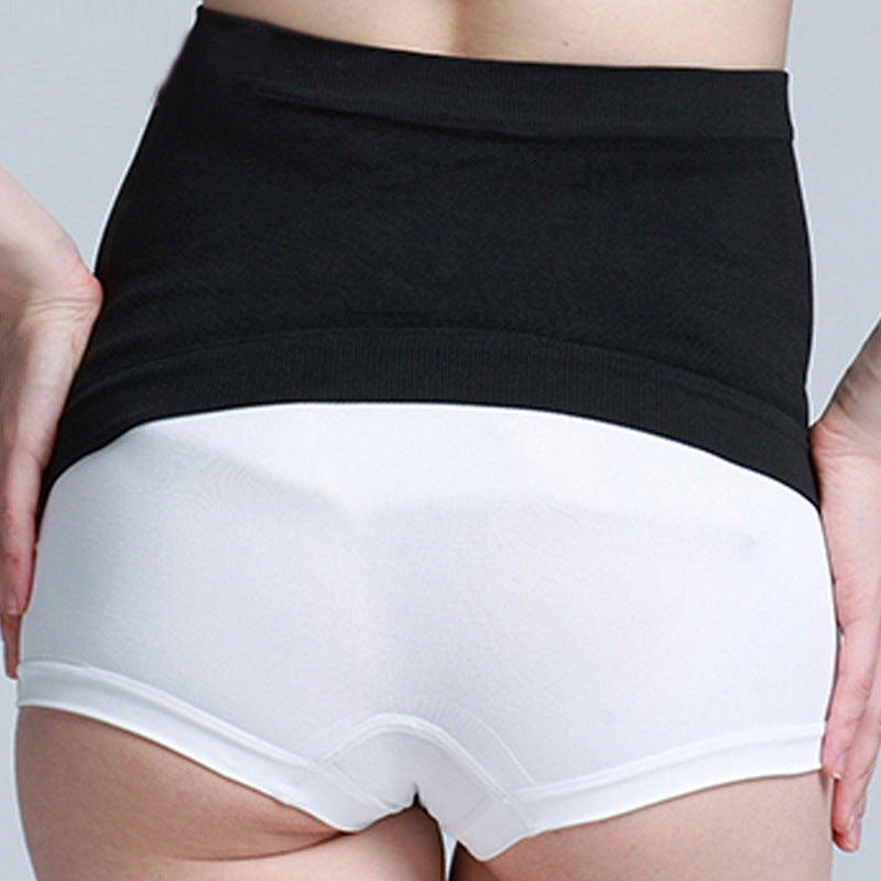 Pregnant woman wearing ChicBump™ seamless belly support band, third trimester