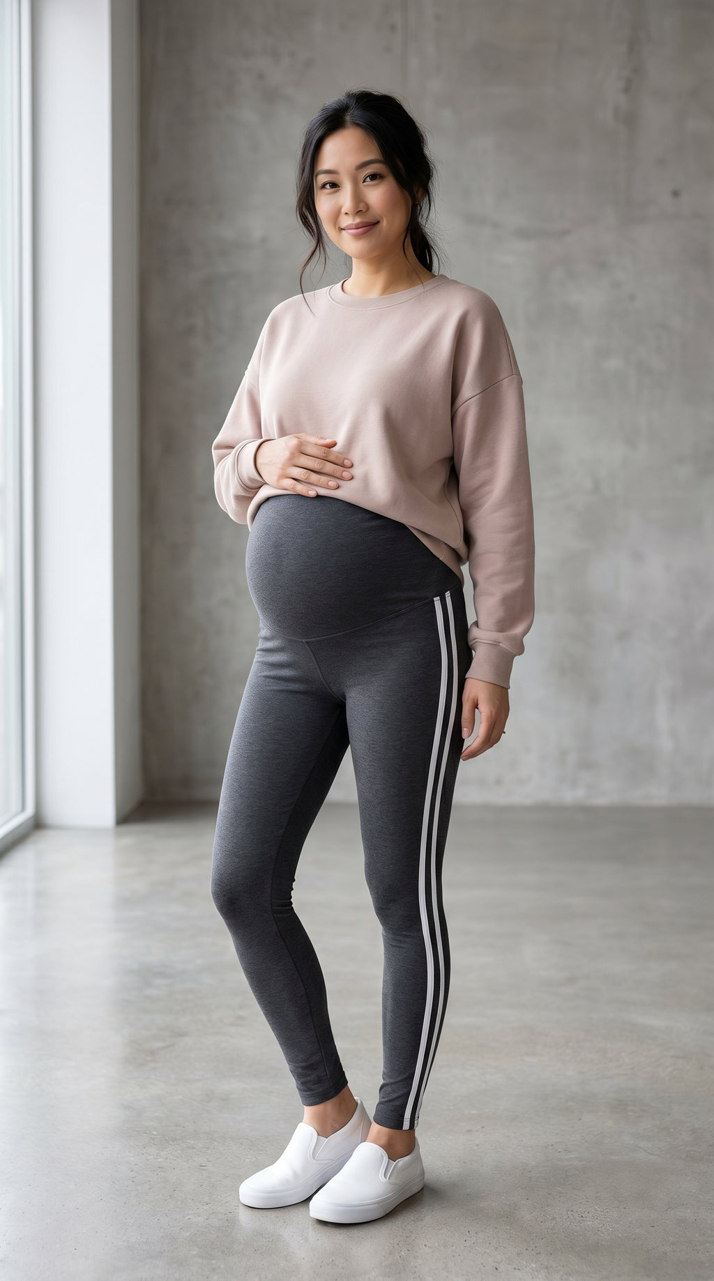 Pregnant woman wearing ChicStripe™ active leggings, third trimester yoga