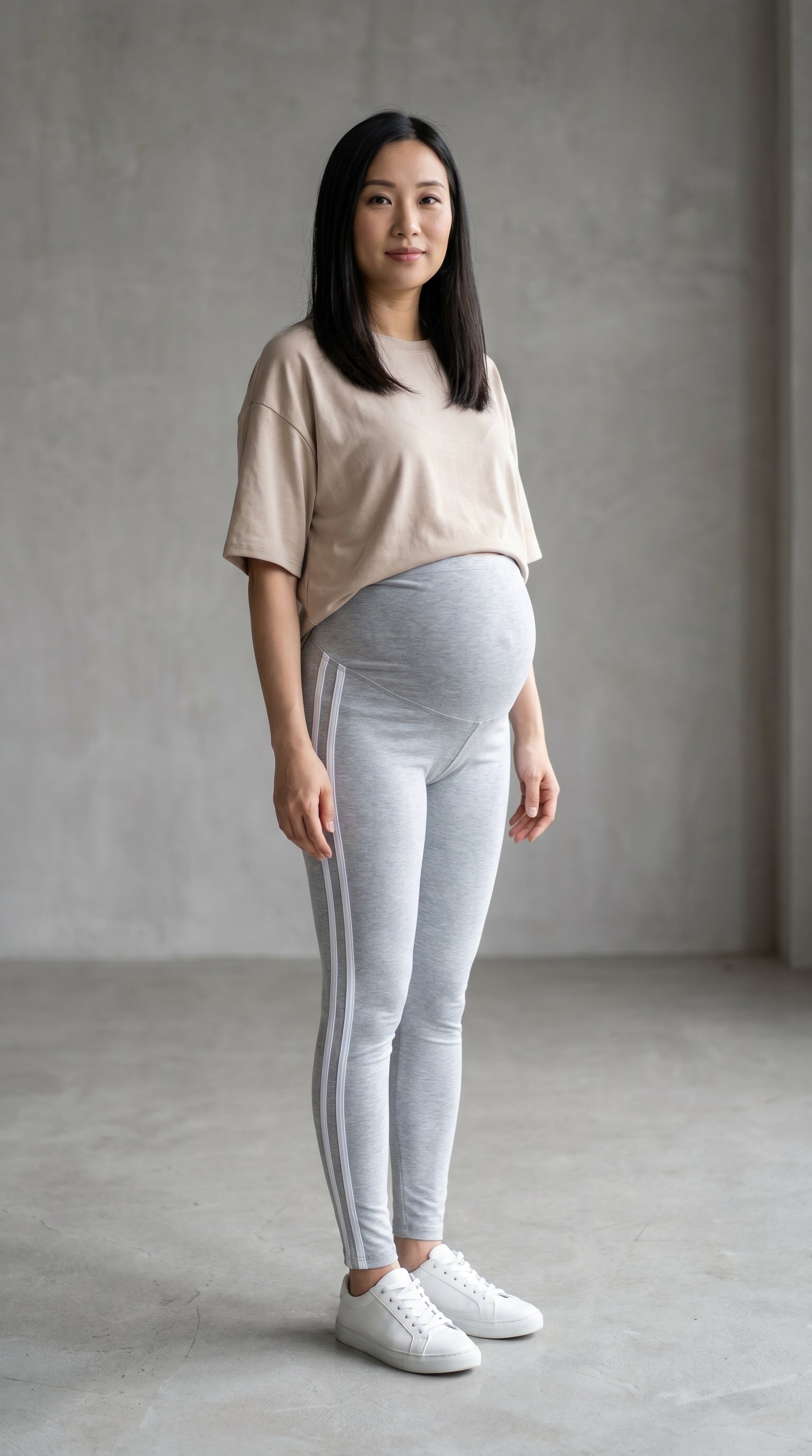 Pregnant woman wearing ChicStripe™ active maternity leggings, gentle yoga