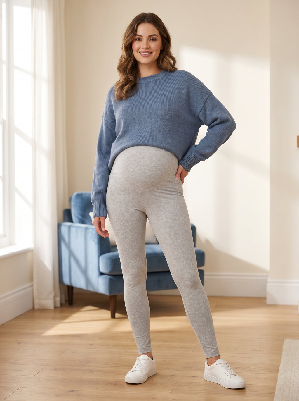 Pregnant woman wearing ChicFleece™ fleece-lined maternity leggings in black, premium editorial