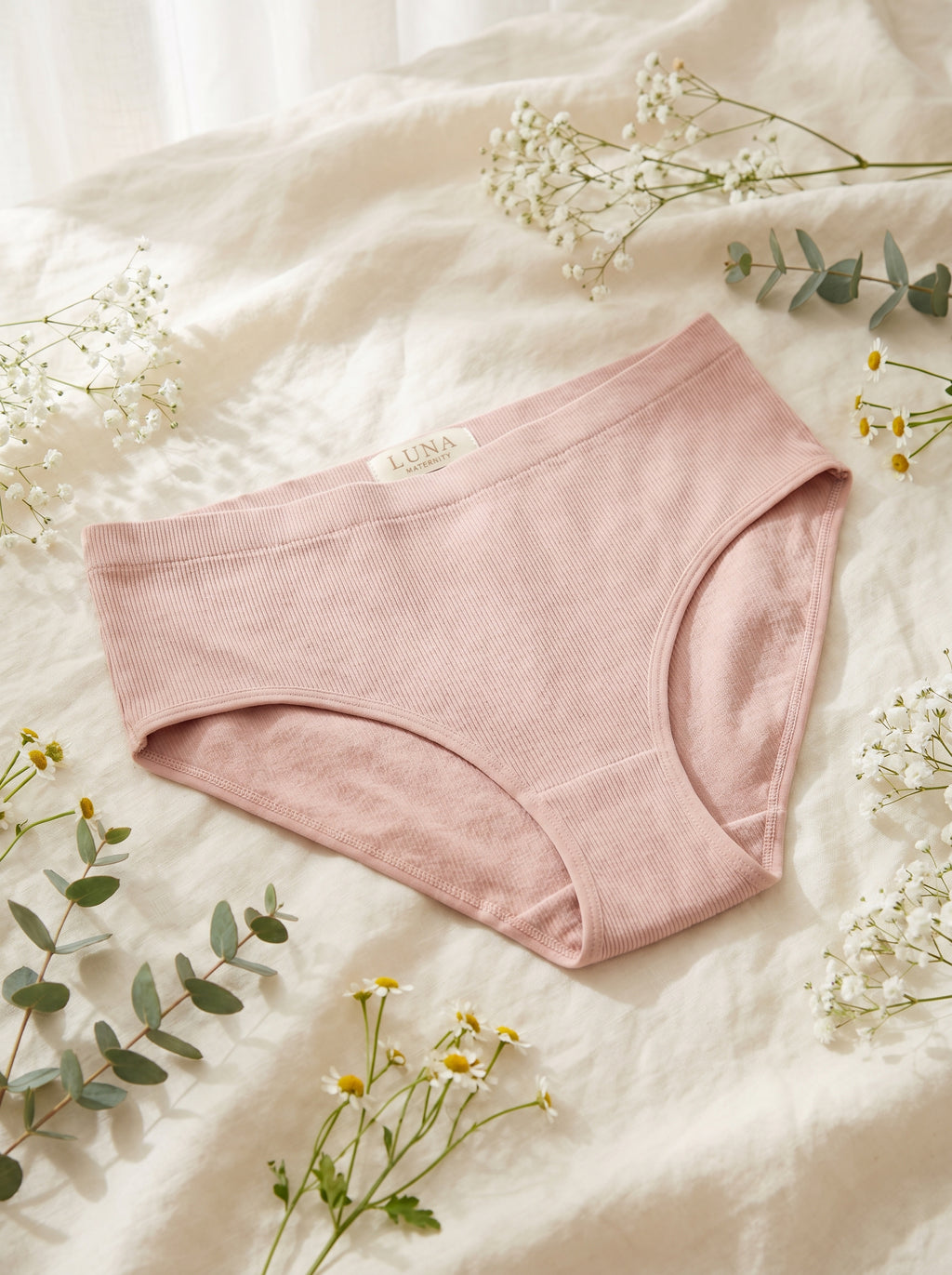 Pregnant woman wearing ChicBump™ antibacterial maternity underwear, premium editorial