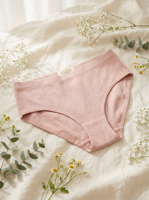 Pregnant woman wearing ChicBump™ antibacterial maternity underwear, premium editorial